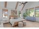 Beautifully appointed bedroom features vaulted ceilings, wood beams, and abundant natural light at 702 Wimbleton Dr, Raleigh, NC 27609