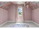 Attic bedroom with floral wallpaper and unique hot air balloon decorations at 702 Wimbleton Dr, Raleigh, NC 27609