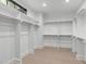 Spacious walk-in closet with ample shelving and hanging space at 702 Wimbleton Dr, Raleigh, NC 27609