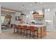 Spacious kitchen with an island, marble countertops, pendant lighting and seating for four at 702 Wimbleton Dr, Raleigh, NC 27609