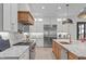 Bright kitchen features custom cabinetry, stainless steel appliances, and marble countertops at 702 Wimbleton Dr, Raleigh, NC 27609