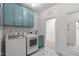Well-equipped laundry room with modern appliances and ample storage space at 702 Wimbleton Dr, Raleigh, NC 27609