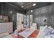 Stylish living room boasts dark gray walls, modern lighting, and elegant furniture at 702 Wimbleton Dr, Raleigh, NC 27609