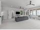 Expansive living room featuring a large TV, access to bathroom, and comfortable seating at 702 Wimbleton Dr, Raleigh, NC 27609