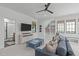 Spacious living room with a TV, storage console, wet bar, and a comfortable sofa at 702 Wimbleton Dr, Raleigh, NC 27609