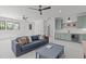 Spacious living room with comfortable seating, built-in shelving, and a wet bar at 702 Wimbleton Dr, Raleigh, NC 27609