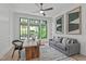 Bright office with natural light, custom wainscotting, modern furniture, and backyard views at 702 Wimbleton Dr, Raleigh, NC 27609