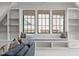 Inviting sitting area with a window seat, built-in shelving, and stylish window coverings at 702 Wimbleton Dr, Raleigh, NC 27609