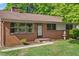 Charming brick home with well-maintained landscaping and inviting front entrance at 717 Fairfield St, Burlington, NC 27215