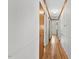 Hallway with hardwood floors, and white paneled walls at 717 Fairfield St, Burlington, NC 27215