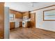This kitchen offers wood cabinets and laminate flooring at 717 Fairfield St, Burlington, NC 27215