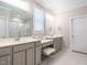 Bright bathroom with dual sink vanity, makeup area and marble tile shower at 725 Banningford Rd, Cary, NC 27518