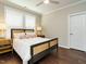 Bright bedroom with hardwood floors and natural light from two windows at 725 Banningford Rd, Cary, NC 27518