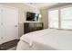 Comfortable bedroom featuring a dresser, tv, and light-colored walls with carpeting at 725 Banningford Rd, Cary, NC 27518