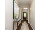 Elegant hallway with hardwood floors, neutral paint, and stylish decor at 725 Banningford Rd, Cary, NC 27518