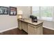 Home office area featuring a large wooden desk and bright light at 725 Banningford Rd, Cary, NC 27518