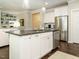 Spacious kitchen with a dark countertop island, stainless steel appliances, and an open layout at 725 Banningford Rd, Cary, NC 27518