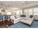 Open living room with a fireplace, built-in shelving, and comfortable seating near the kitchen at 725 Banningford Rd, Cary, NC 27518