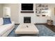 Bright living room with a fireplace, built-in shelving, and comfortable seating at 725 Banningford Rd, Cary, NC 27518