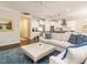 Open living room with a fireplace, built-in shelving, and comfortable seating near the kitchen at 725 Banningford Rd, Cary, NC 27518