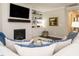 Bright living room with a fireplace, built-in shelving, and comfortable seating at 725 Banningford Rd, Cary, NC 27518
