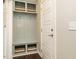 Mudroom with custom shelving and drawers with wood floors at 725 Banningford Rd, Cary, NC 27518