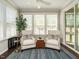 Cozy sunroom featuring comfortable seating, natural light, and a serene atmosphere at 725 Banningford Rd, Cary, NC 27518
