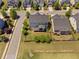 An aerial view that captures the community layout of residential homes and landscaping at 7700 Stonehenge Farm Ln, Raleigh, NC 27613