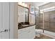 Elegant bathroom featuring dark granite counters, and glass-enclosed shower at 7700 Stonehenge Farm Ln, Raleigh, NC 27613