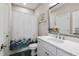 Bright bathroom with modern fixtures, a stylish shower curtain, and elegant design elements at 7700 Stonehenge Farm Ln, Raleigh, NC 27613