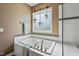 Elegant bathroom featuring a soaking tub and tiled walls at 7700 Stonehenge Farm Ln, Raleigh, NC 27613
