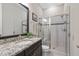 Bathroom with granite countertop, glass enclosed shower, and neutral color scheme at 7700 Stonehenge Farm Ln, Raleigh, NC 27613