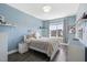 Comfortable bedroom with ample natural light and stylish décor, creating a cozy retreat at 7700 Stonehenge Farm Ln, Raleigh, NC 27613