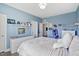 Bright bedroom with plush bedding, and decorative shelves at 7700 Stonehenge Farm Ln, Raleigh, NC 27613