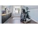 Home exercise room with equipment and natural light, perfect for staying active and healthy at 7700 Stonehenge Farm Ln, Raleigh, NC 27613