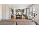 Modern kitchen featuring a large island with seating, gray cabinets, and stainless steel appliances at 7700 Stonehenge Farm Ln, Raleigh, NC 27613
