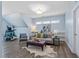 Living room with lots of light, and updated vinyl flooring at 7700 Stonehenge Farm Ln, Raleigh, NC 27613