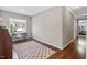 Office space with natural light, hardwood floors and an area rug at 7700 Stonehenge Farm Ln, Raleigh, NC 27613