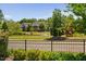 Charming pond view with a fountain, surrounded by well-kept lawns and a play area, perfect for relaxation at 7700 Stonehenge Farm Ln, Raleigh, NC 27613