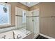 Glass enclosed shower with black and white tile at 7700 Stonehenge Farm Ln, Raleigh, NC 27613