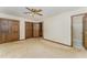 Bedroom with double closets, ceiling fan and an ensuite bathroom at 8409 Crowder Rd, Raleigh, NC 27603