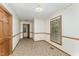 Empty room with carpet, a window, and decorative wallpaper border on the walls at 8409 Crowder Rd, Raleigh, NC 27603