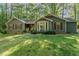 Well-maintained home with a bay window, shutters, and a manicured lawn at 8409 Crowder Rd, Raleigh, NC 27603