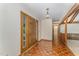 Inviting foyer with beautiful parquet floors and a light fixture, showcasing a warm welcome at 8409 Crowder Rd, Raleigh, NC 27603