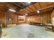 Spacious garage with concrete floors, wooden walls, and ample storage space at 8409 Crowder Rd, Raleigh, NC 27603
