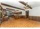 Open concept kitchen and dining area, wood beams, and wooden cabinetry at 8409 Crowder Rd, Raleigh, NC 27603