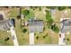 An aerial view of a home with an expansive backyard including a brick firepit, sitting area and various outbuildings at 870 Kentucky Derby Ln, Lillington, NC 27546