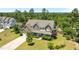 Aerial view of a two-story home with mature trees and landscaping at 870 Kentucky Derby Ln, Lillington, NC 27546