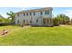 Expansive backyard with a well-maintained lawn, a wooden deck, and lush greenery for outdoor enjoyment at 870 Kentucky Derby Ln, Lillington, NC 27546