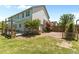 Serene backyard featuring a wooden deck, brick patio, and well-kept lawn, ideal for relaxation and entertainment at 870 Kentucky Derby Ln, Lillington, NC 27546